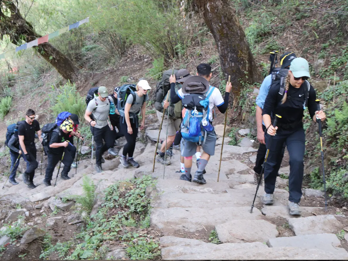 Trekkers climbing stairs to ABC