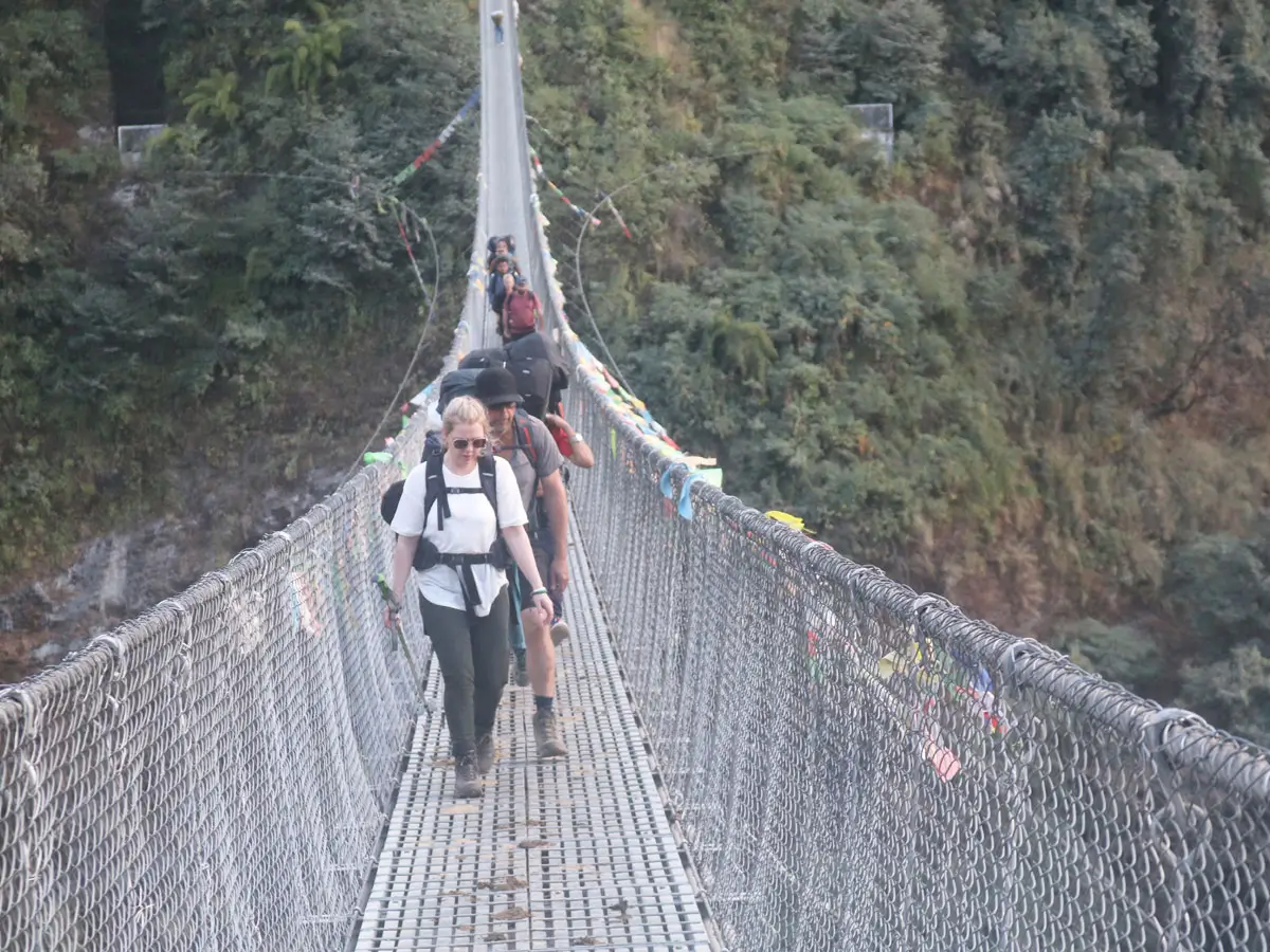 Our clients crossing bridge on ABC Trek